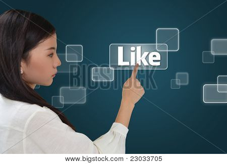 Picture or Photo of Business woman pressing like button on screen