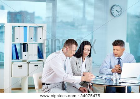Picture or Photo of Image of confident partners sharing new ideas at meeting