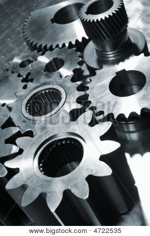 Picture or Photo of Industrial titanium and steel gear parts all in a metallic blue toning concept