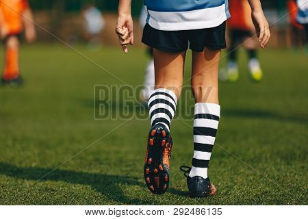 Poster: Legs Of Boy Footballer In