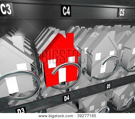 Picture or Photo of A single red unique house stands out from the competition in a vending machine representing a crowded real estate market and a buyer