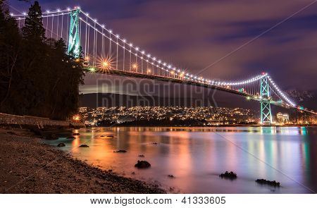 Picture or Photo of Vancouvers Lions Gate Bridge At Night with beautiful reflection