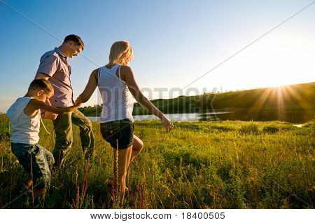 Picture or Photo of Happy family having fun outdoors
