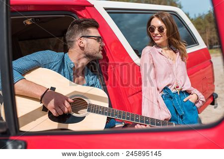 Poster: Handsome Man Playing Acoustic Guitar