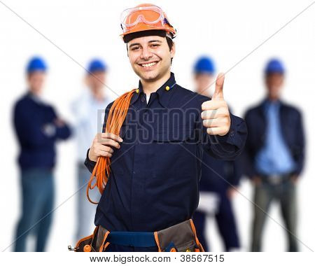 Picture or Photo of Portrait of an happy worker in front of his team