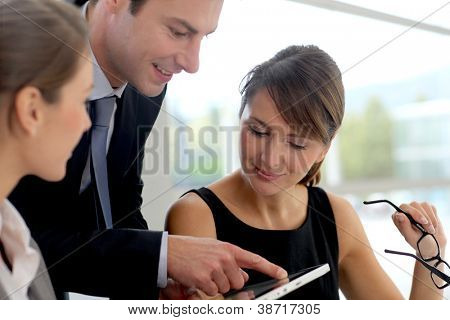 Picture or Photo of Business people meeting in office to discuss project