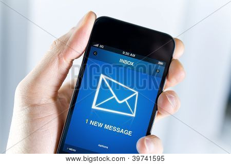 Picture or Photo of A man holding smartphone with one new message on a screen. Closeup shot.