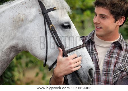 Picture or Photo of Teen stroking horse