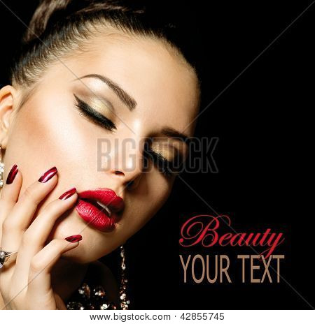 Picture or Photo of Beauty Woman with Perfect Makeup. Beautiful Professional Holiday Make-up. Red Lips and Nails. Beauty Girl
