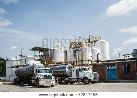 Picture or Photo of Chemical Industry Storage Tank And Tanker Truck In Industrial Plant